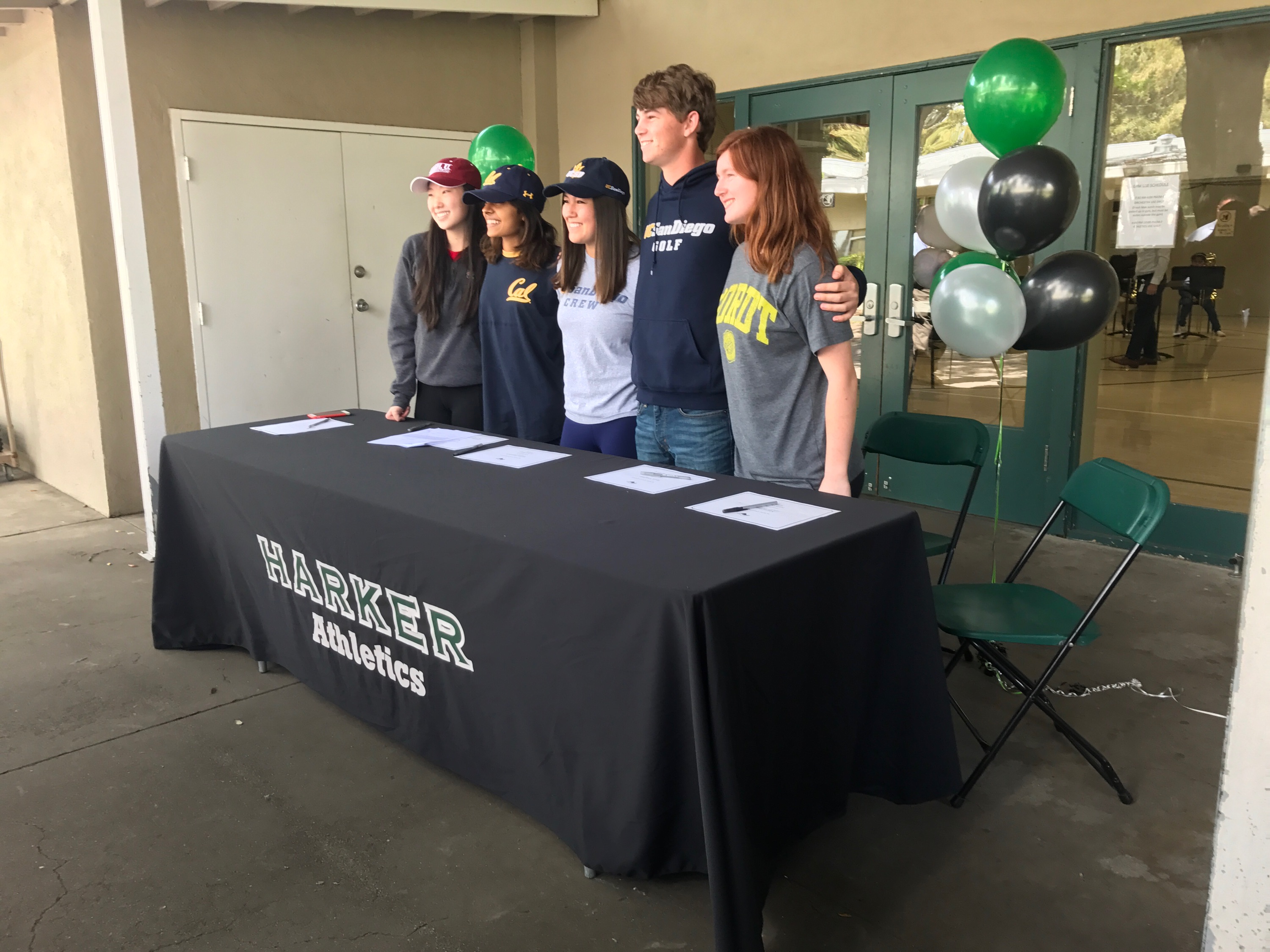 Seniors Rachel Cheng, Niki Iyer, Taylor Iantosca, Ryan Vaughan, and Marti Sutton pose for a photo. These five seniors signed for their respective college athletics programs today.