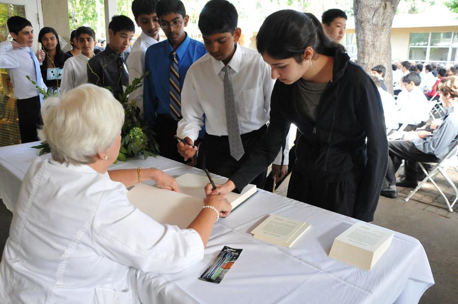 New students line-up to sign the Matriculation book under the watchful eye of Mrs. Tebo, 187 new 9th graders join the Upper School.