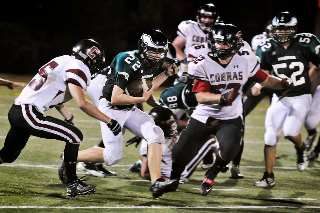 Varsity football falls to Cochrane 20-62