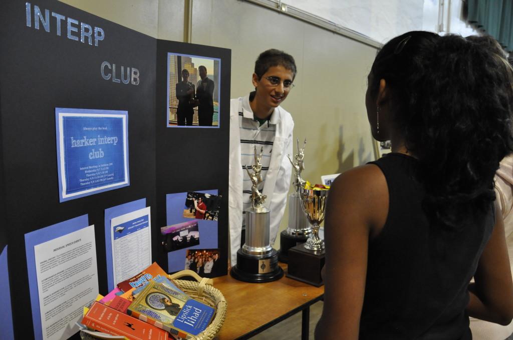 Ishan Taneja (12) shares information on the new Interp Club with a prospective member at Club Fair.