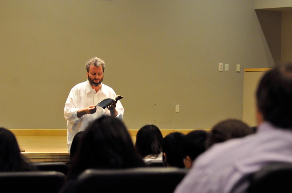 Poet Joseph Lease reads to an audience of students and faculty in Nichols auditorium. Lease is the latest in a series of speakers presented by the Cum Laude Society. 