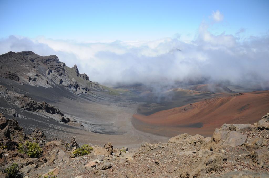 Rocks+litter+the+edge+of+the+volcanic+crater+as+clouds+shade+it+from+harsh+sunlight.+The+Haleakala+National+Park+was+a+constant+source+of+wonder+and+amazement+for+the+group+of+19+Upper+School+journalism+students+who+visited+on+June+28.+In+order+to+preserve+the+wildlife%2C+groups+can+be+only+12+people+or+less.