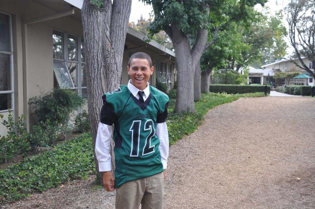 Christian is suited up in his football jersey in preparation for the game against San Jose High School.