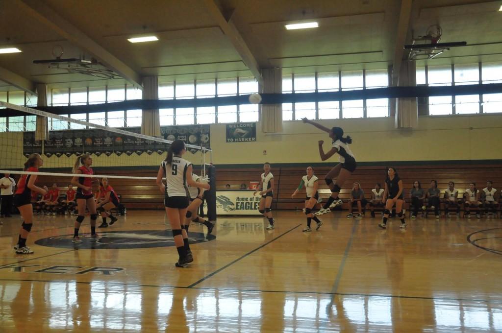 Divya Kalidindi (11) jumps from the back row to take one of her many swings of the game. She tied for most kills during the match. 