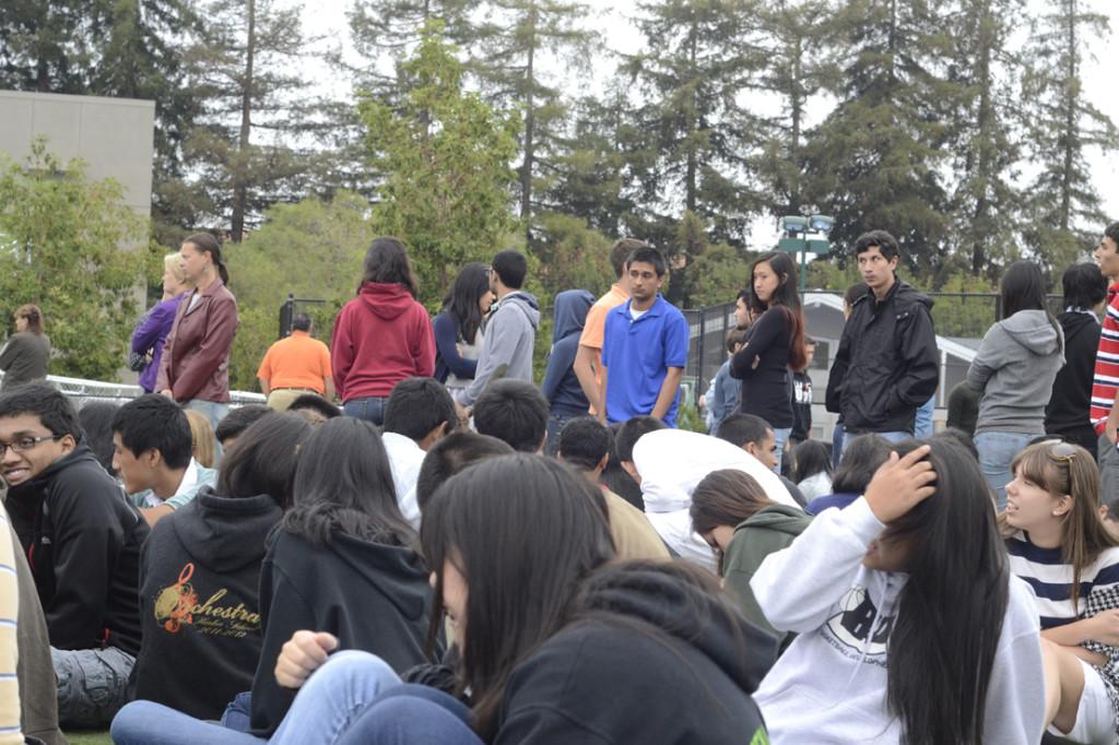 Students line up in their respective advisories on David Field as teachers take attendance. The first drill serve as practice or a reminder for emergency procedures.