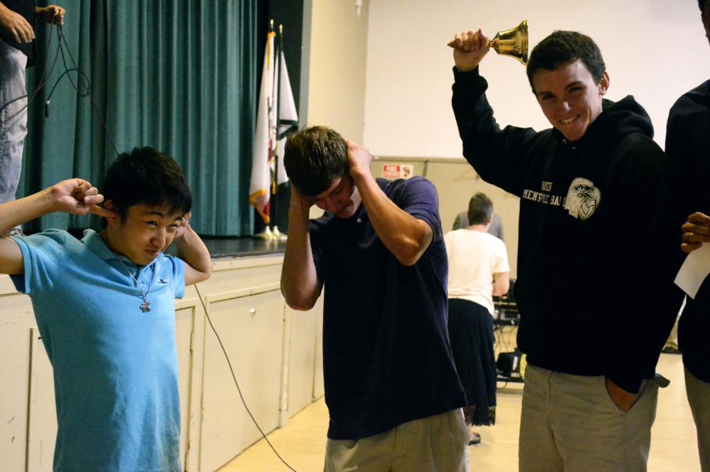 ASB Secretary David Lindars (12) reenacts ringing a bell to signal the beginning of school meeting. The council members thought using the bell would be a quicker and more effective way to start school meetings.