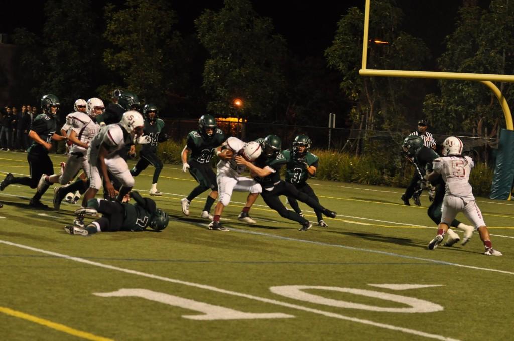 Junior Kevin Moss tries to cease the ball from a rival. Knowing what was at stake, the team fought hard to fend off the opponents, especially during those key last minutes.