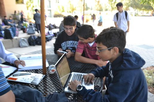 Students, including Ayush Midha (10) and Neil Sadhu (10), complete their homework on the lunch tables. The school day was cut short on Monday, October 8, giving students extra time to do whatever they saw fit.