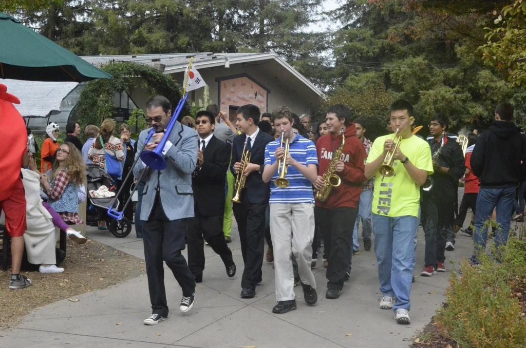 Upper School Director of Instrumental Music, Chris Florio, leads the Jazz Band in the head of the Panoply of Chaos parade during long lunch on Halloween day. The parade also gave the chance for the classes to display their Homecoming floats.