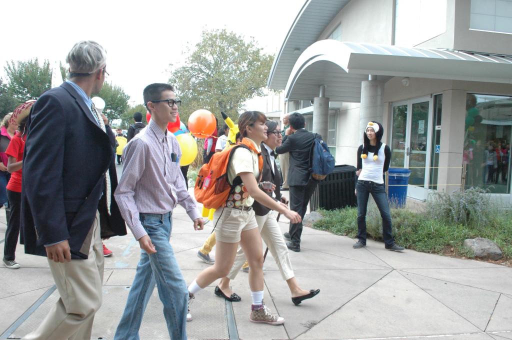 Seniors show off their class pride in the Homecoming Parade. With some modifications to normal clothing, these seniors are characters from the Pixar Disney movie UP.