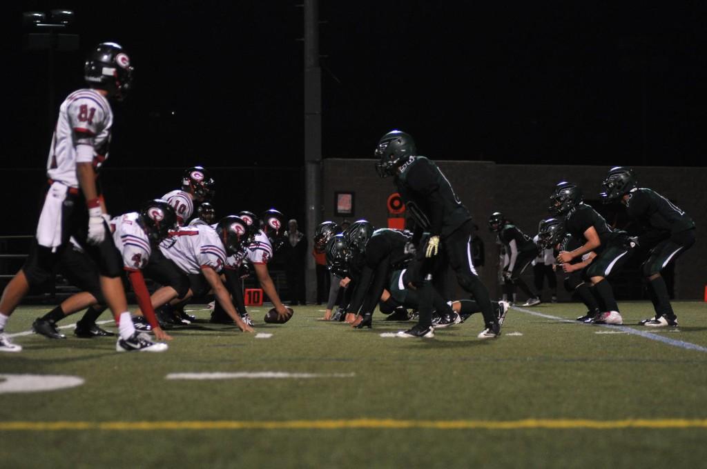 The football team attempts to defend their side during the fourth quarter. On Friday, October 5, the Eagles lost to the Titans by a score of 21-49.