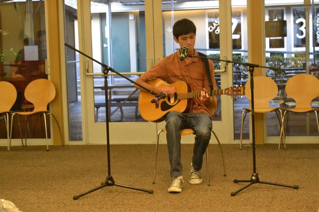 Senior Justin Gerard sings while playing the guitar at this years first Coffee House event held in Manzanita Hall. The event was organized by the members of Improv Troupe.