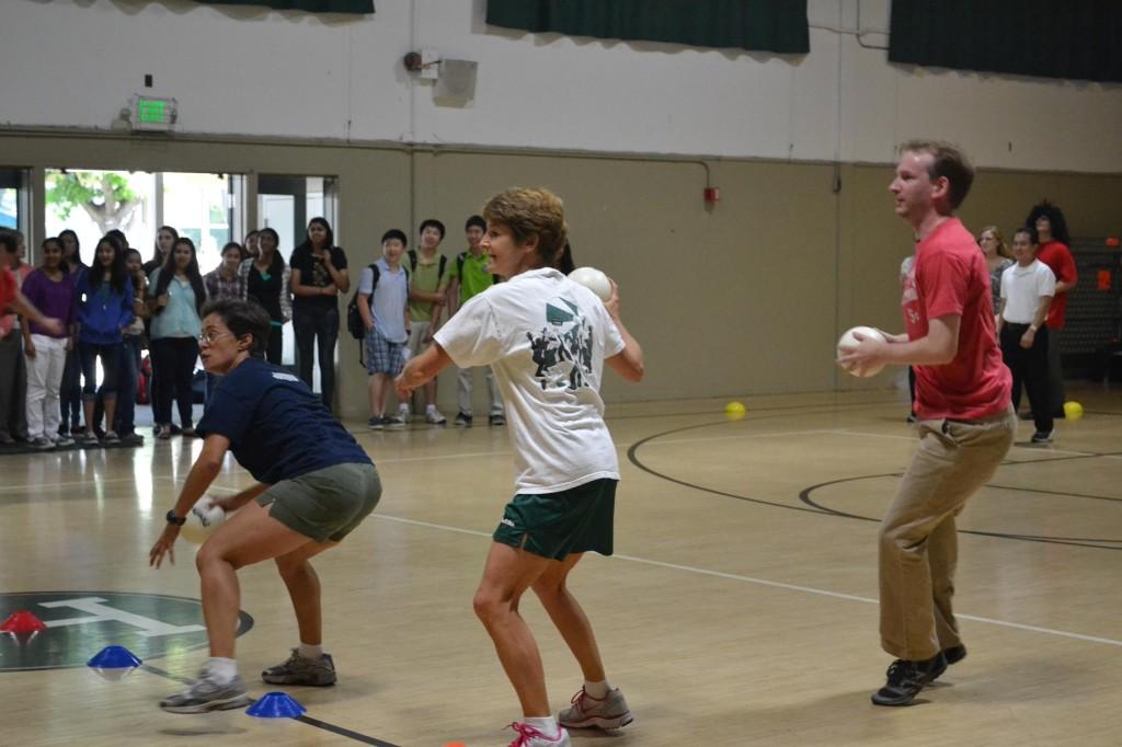 Diana Moss, Rachel Freed, and Chris Spenner prepare to strike their opponents in hopes of rising victorious. On October 3, the faculty claimed their first victory in years as they defeated the junior class in two out of three games. 