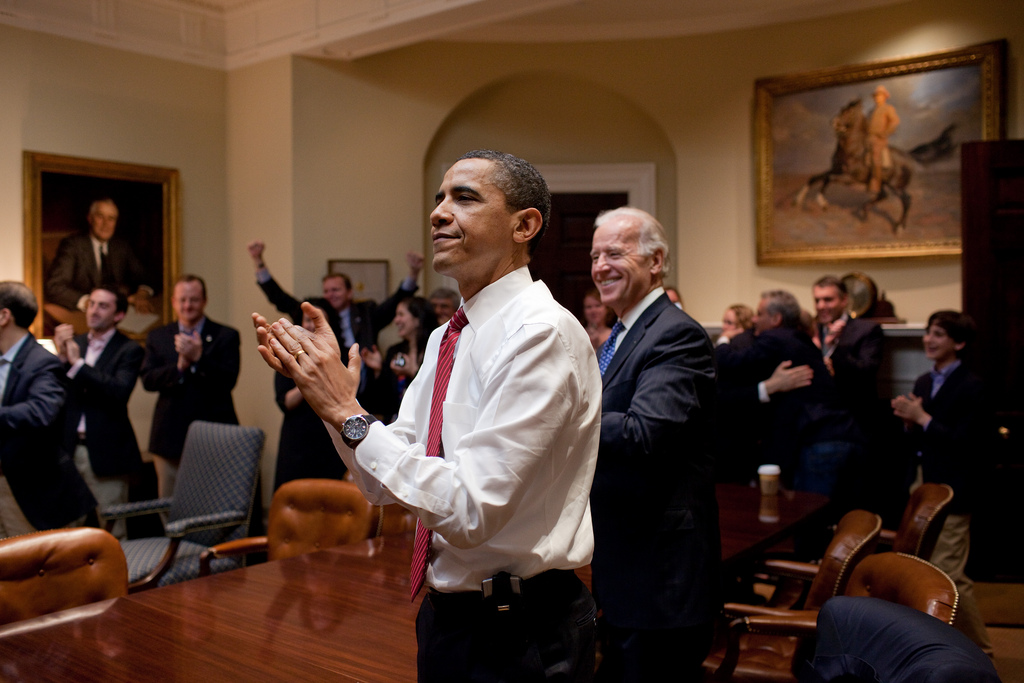 President Barack Obama rejoices with Vice President Joe Biden and the senior staff in the Roosevelt Room of the White House as the House passes the health care reform bill on March 21, 2010. Obama won the Presidential Election on Wednesday night, establishing his second term as president.