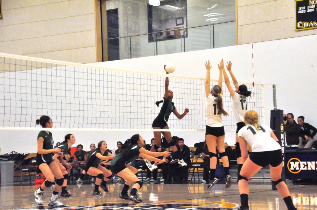 Junior Divya Kalidindi spikes the ball past an attempted block by Harbor. On Wednesday, November 14, the girls volleyball team travelled to Menlo to play in CCS semifinals.