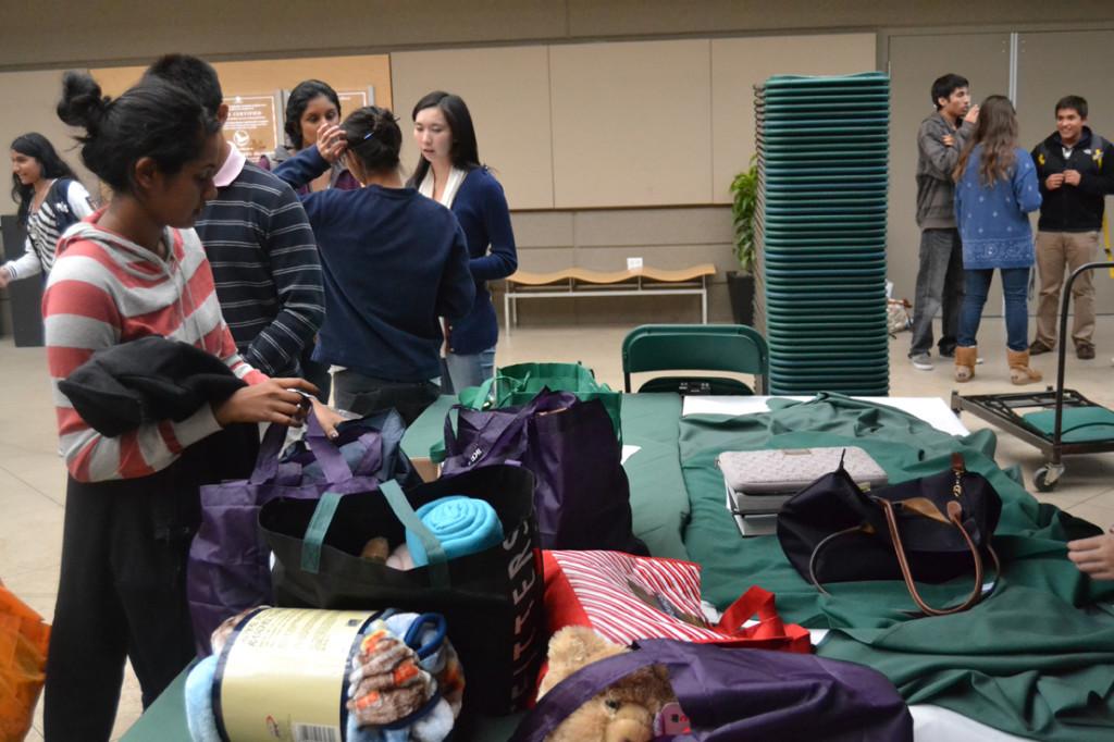 Students work on creating goody bags with warm blankets, teddy bears, and handwritten Christmas notes. Key Clubs goal is not only to work on community service projects, but also to inspire other people to care for the community.