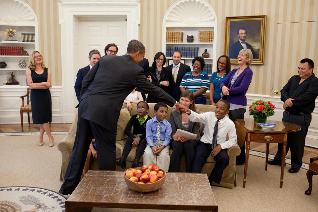President Barack Obama fist-bumps with a boy from the education documentary Waiting for Superman in the Oval Office on October 11, 2010. Obama was reelected and a number of propositions in California, including Proposition 30, were passed yesterday.