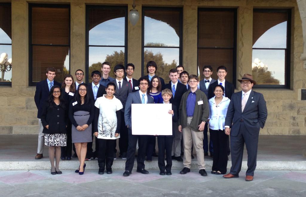 Delegates pose for a group picture of their committee in front of the main entrance to Stanford University. The MUN conference was held during the weekend.