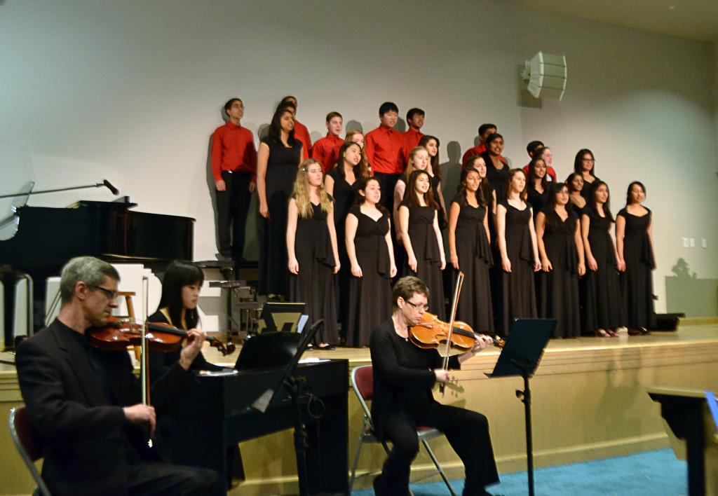 Bel Canto sings while accompanied by Paul Woodruff, Toni Woodruff, and Serena Wang. The choir performed on January 18 at the Wintersong concert in Nichols Auditorium.