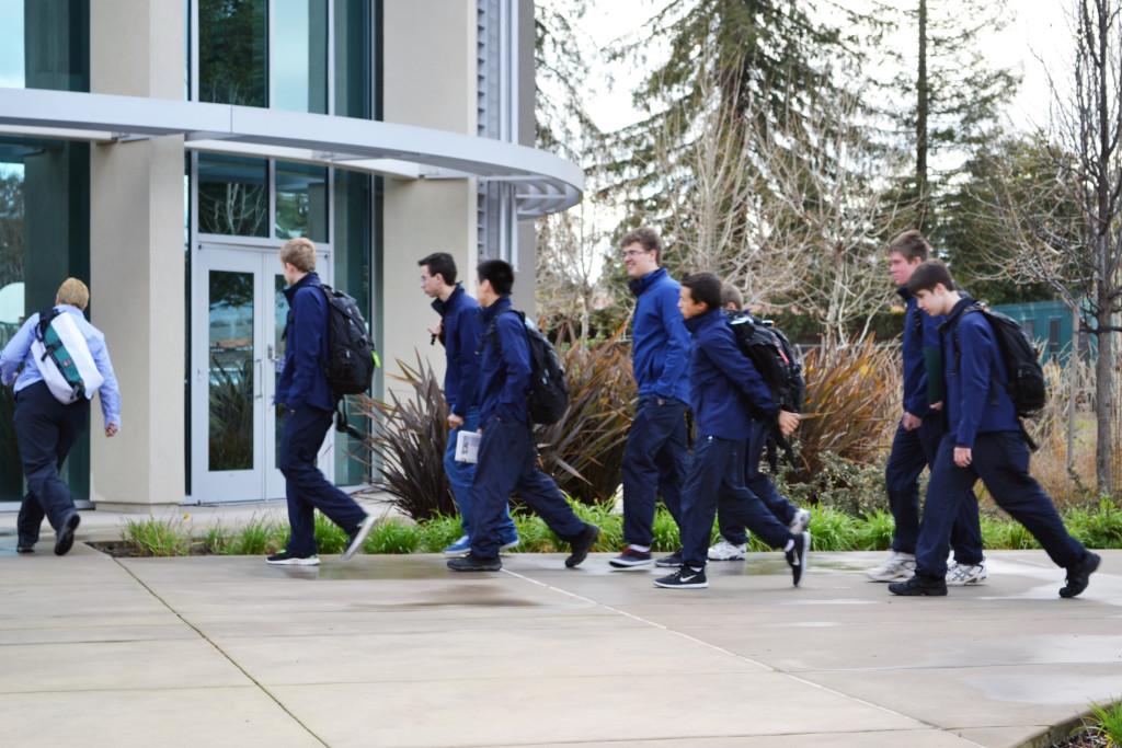 After school meeting is dismissed, the Code Cadets walk from the gym to Nichols in a group. Assistant technology director Diane Main led the boys to the third period computer science class they planned to attend.