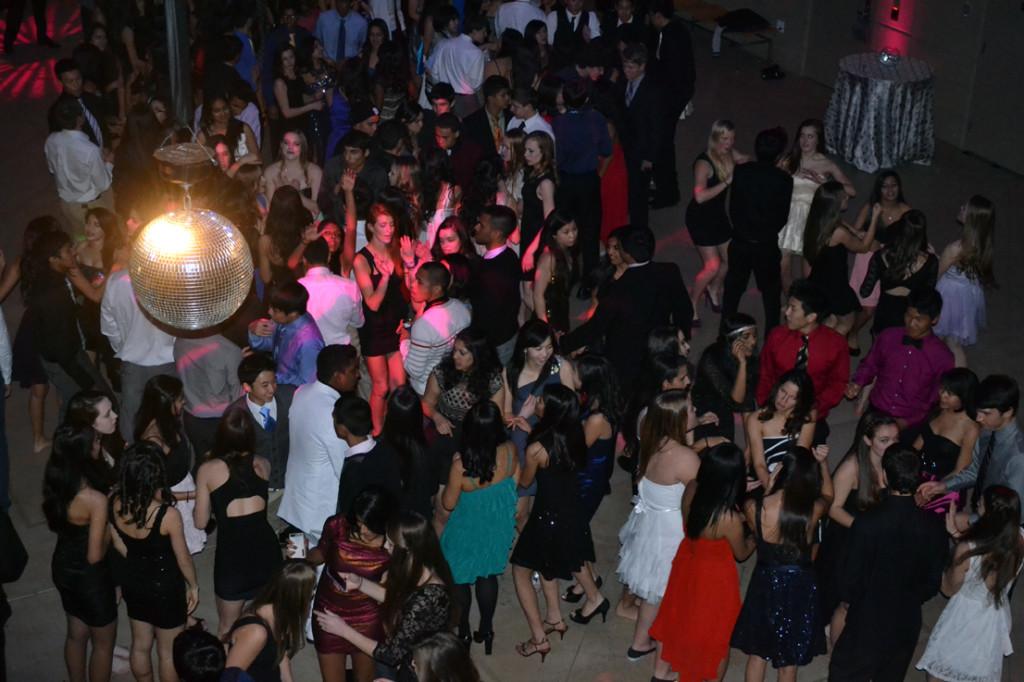 Students dance to their upbeat, chart-topping favorites on the hallway-turned-dance-floor. This year's Supernova themed Winter Ball was held in the Atrium on Saturday, January 12.