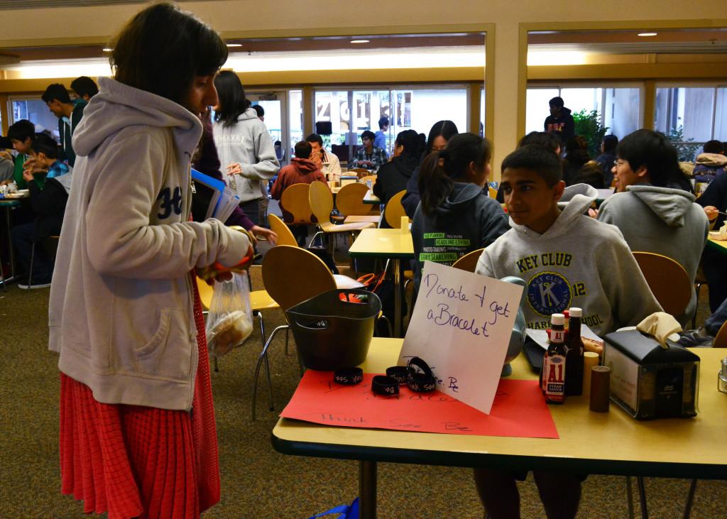 During lunch on Tuesday, Zina Jawadi (11) donates to the road safety awareness campaign. The L.I.F.E. board will host the fundraiser throughout the week in order to expand outreach and awareness about the importance of attentive driving.