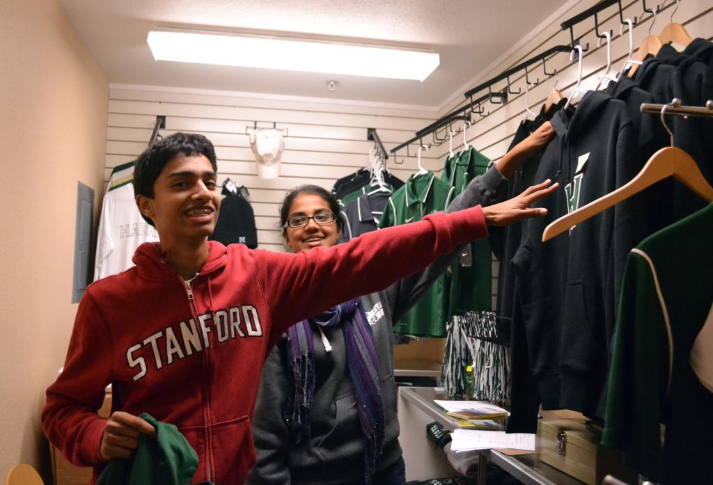 Eagle Express Customer Kunal Mehta (9) reaches for a sweatshirt to try on. The Eagle Express had $350 in sales within two days of its opening.