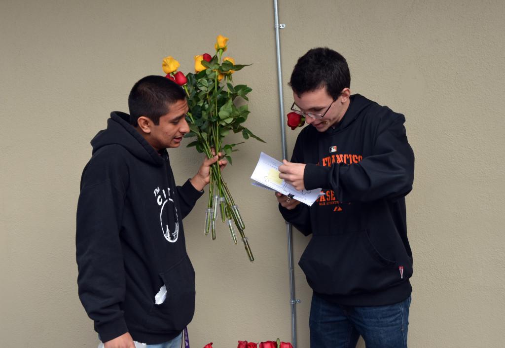 Seniors+Raghav+Sehtia+and+David+Lindars+check+their+list+again+to+make+sure+the+students+receive+all+of+their+chocolates+and+roses.+ASB+members+helped+ensure+the+proper+delivery+of+Valentine+grams+to+advisories.