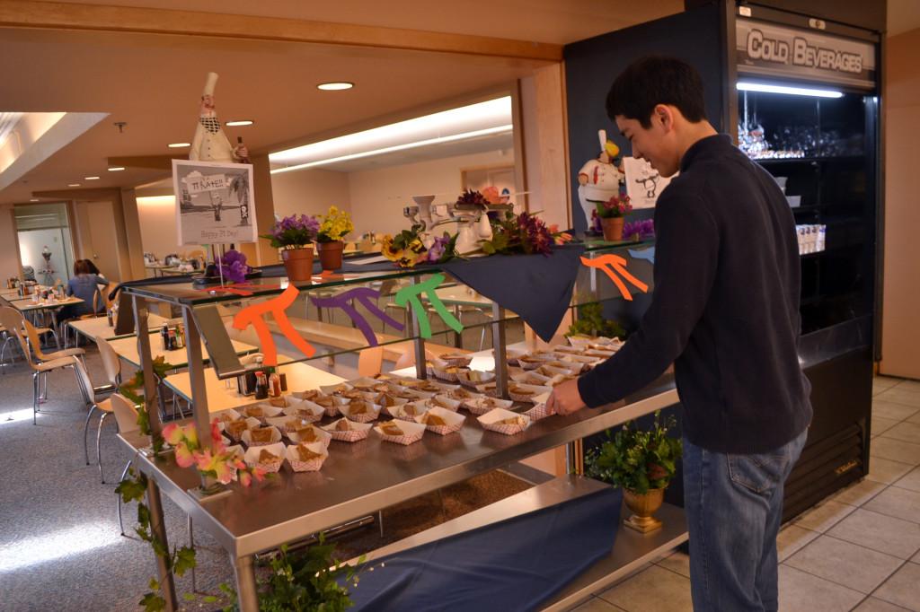 Sophomore Alex Jang enjoys a piece of pie during lunch today. In honor of National Pi Day, the kitchen staff served different types of pie and decorated tables with pi signs.