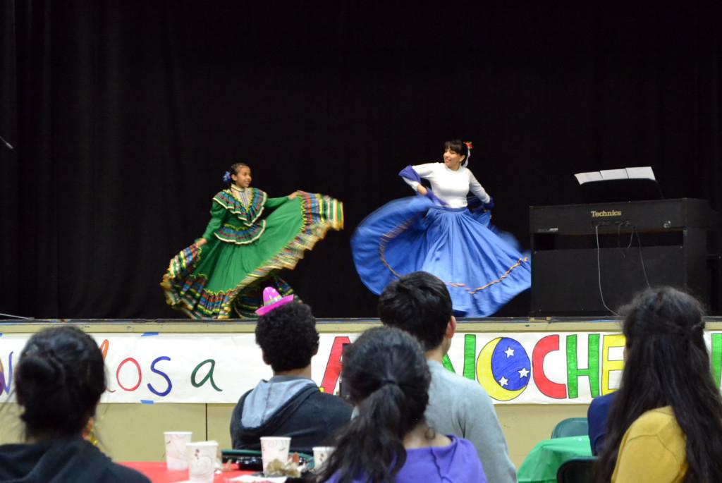 Math+teacher+Jeanette+Fernandez+and+her+daughter+perform+a+Spanish+dance+in+traditional+attire.+They+participated+in+the+annual+Spanish+Cultural+Night+hosted+by+Spanish+National+Honor+Society.