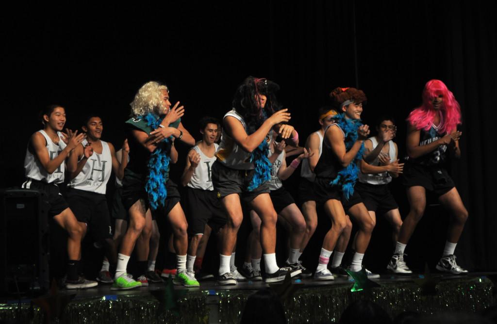 Donning colorful wigs and blue feather boas, Spenser Quash (12), JP Doherty (12), Sean Pan (11), and Nikhil Panu (12) lead the boys basketball team in their rendition of Beyonces Single Ladies. The panel of judges selected the Varsity teams performance as Best Overall Act.