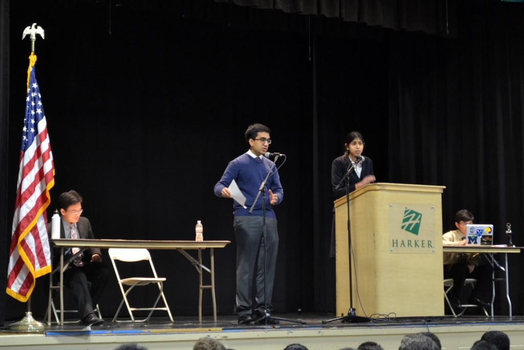 Junior Saachi Jain and Anuj Sharma (12) engage in cross examination during Wednesdays debate on gun control. During this time, the two discussed at which point the government should intervene with legislature concerning ownership of assault weapons.