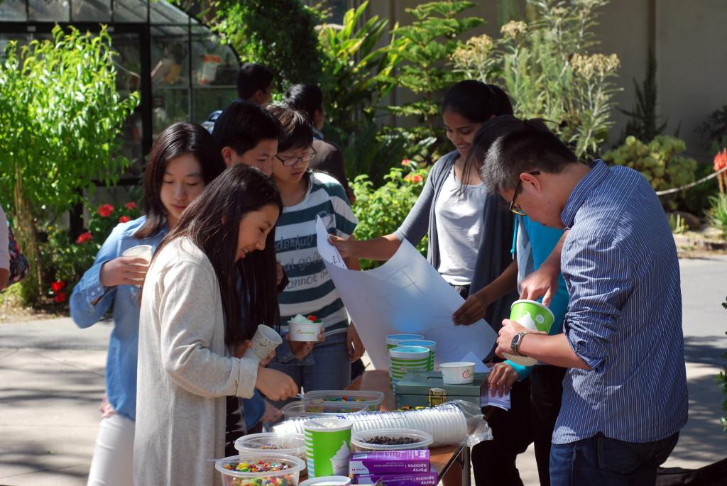 Students choose from a variety of frozen yogurt flavors and toppings sold by Interact outside of Manzanita after school. The club raised money for schools and libraries in Bangladesh.