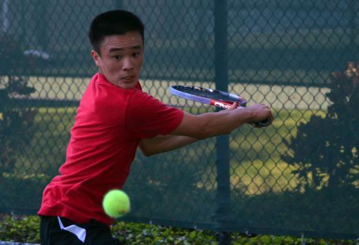 Sophomore Jason Chu prepares to hit the ball during the last home game against league front-runner Menlo. Despite strong performances, the team lost 0-7. However, the boys will keep practicing through next week because they qualified for CCS.