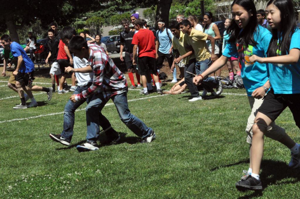 Students cheer on their peers during the three-legged race. The juniors ended up placing first in both lunches.