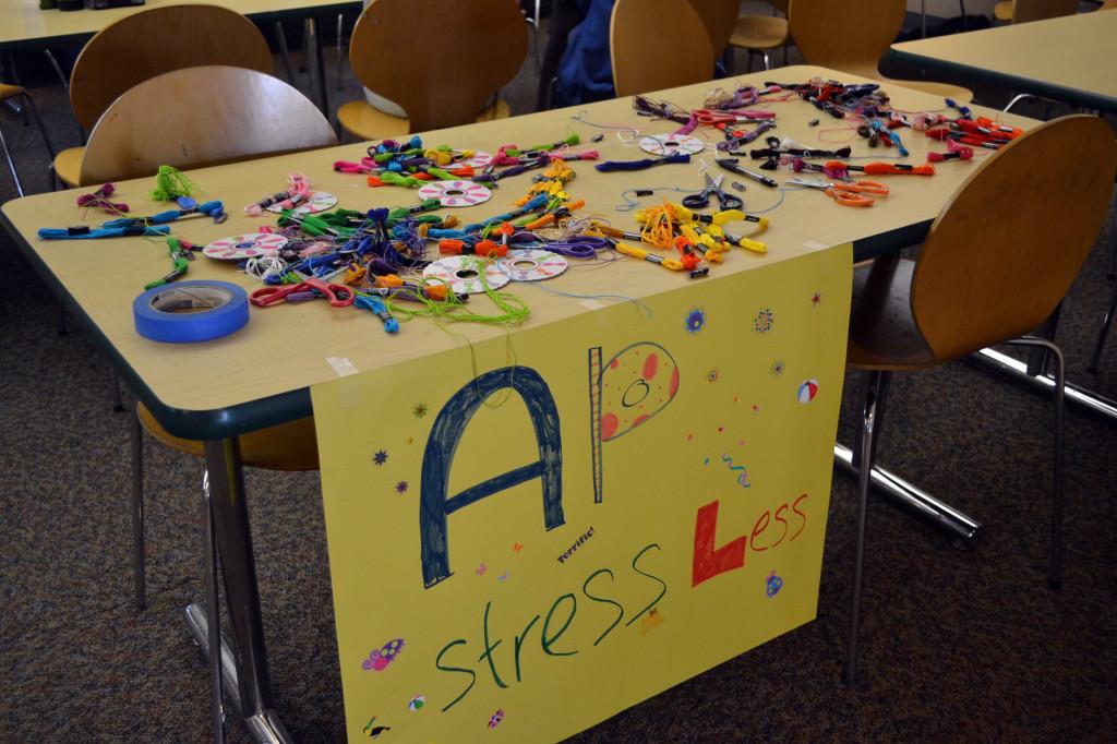 The AP Stress Less table allows students to create friendship bracelets and take their minds off of the AP tests. Materials were set up on the table in Manzanita.