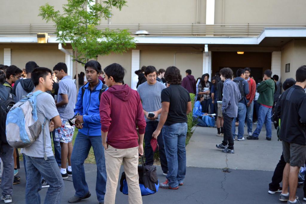 Students wait outside the gym for the AP Chemistry exam. The tests, given by the College Board, are taken by students across the nation, and test-takers receive their results in July.