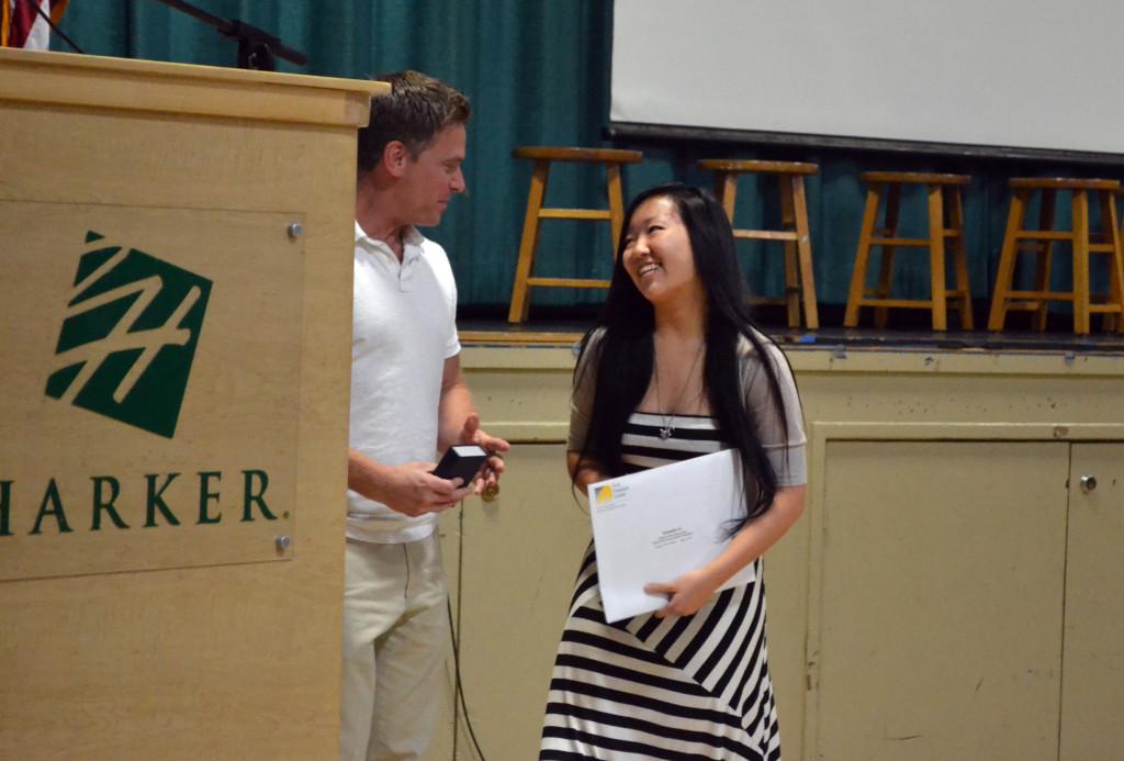 Junior Connie Li accepts her $2,500 cash prize for her essay from history teacher Damon Halback, who helped her with her work. Connie placed first out of more than 1,800 candidates.