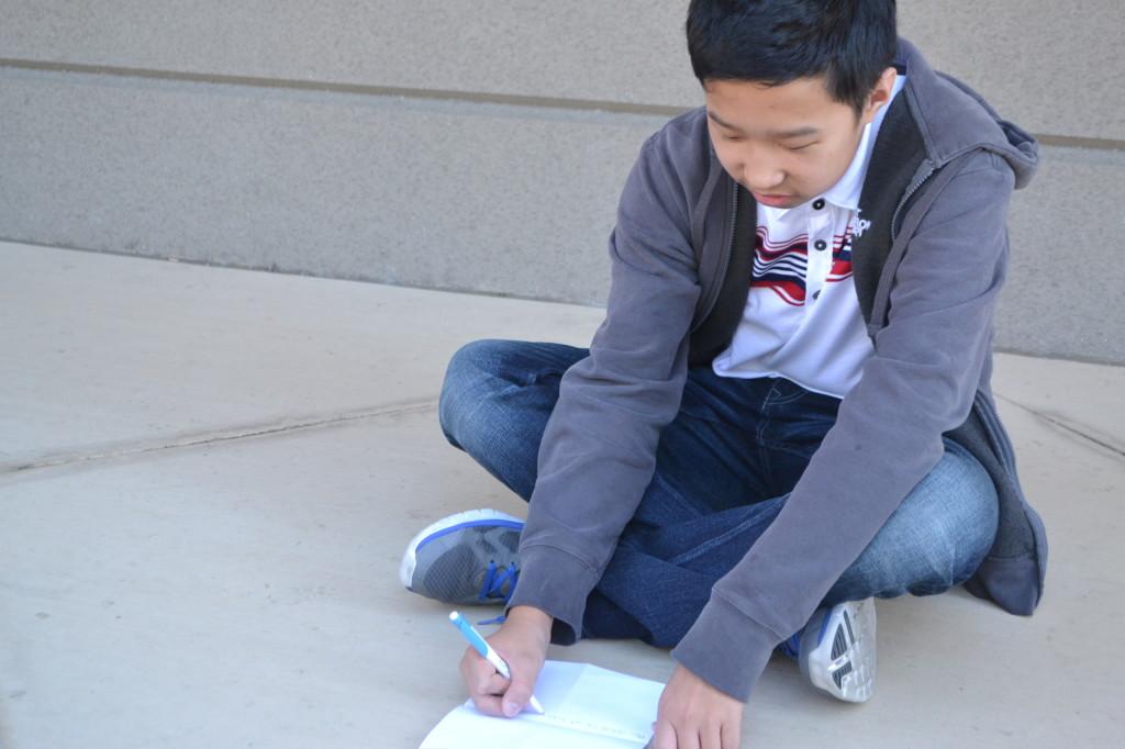 Sophomore Justan Su (10), upon request by TalonWP, writes a letter to his eagle buddy in order to introduce himself. The Eagle Buddies program was designed to foster a greater sense of community cross-campus, and allows upper school students to have fun while being role models.
