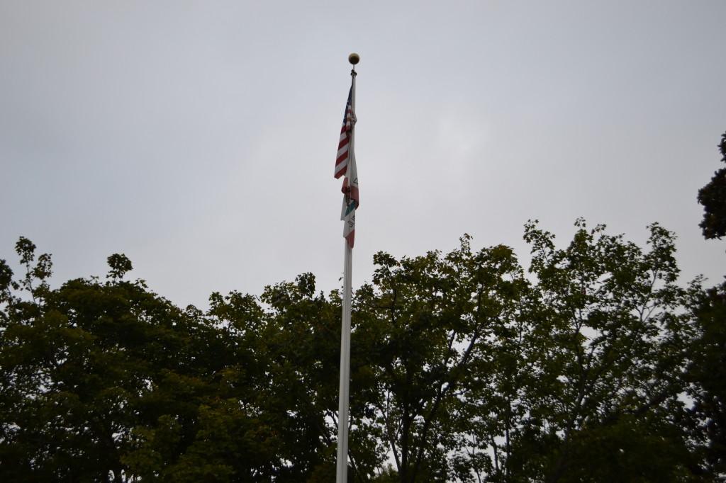 Students+and+staff+honor+those+lost+in+the+9%2F11+attacks+twelve+years+ago.+The+flag+in+the+quad+was+lowered+to+half-mast+as+a+sign+of+respect.+