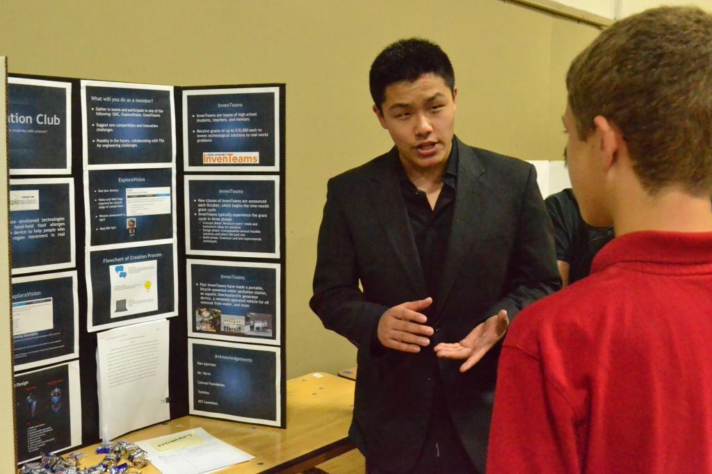 Justin Young (12), president of the Innovation Club, explains the purpose of his club to newcomers, hoping to recruit new members to compete in Inventeams. The annual Club Fair allowed many different clubs to promote their clubs and let students sign up for the ones that interested them the most.  