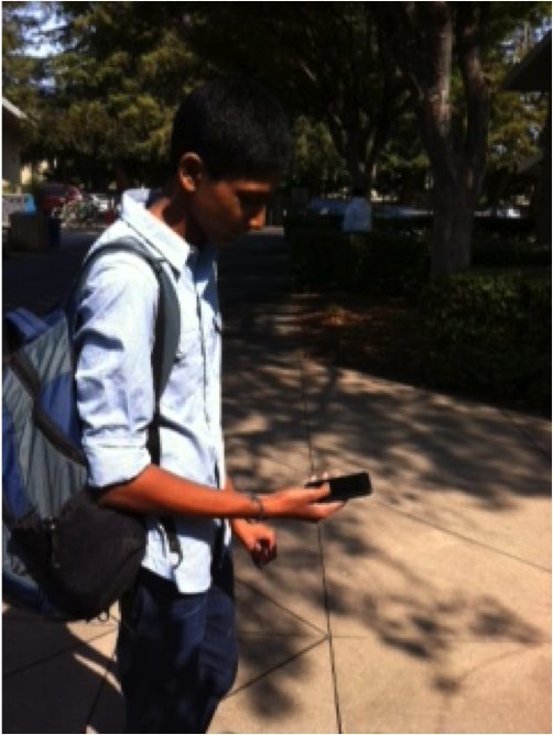 Sriram Somasundaram (11) checks his phone to see what his schedule for the day looks like. The iPhone is a popular smartphone among students and allows them to access information on the go.