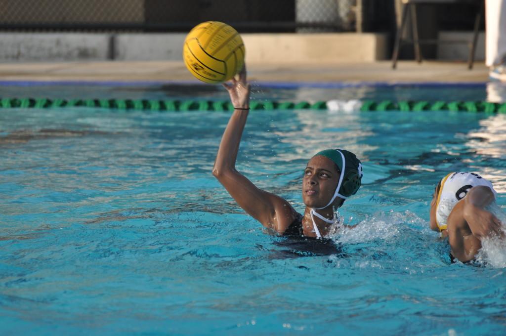 Anushka Das (11) leaps up for a catch during todays water polo game against Wilcox High School. She contributed one goal to the Eagles seven.