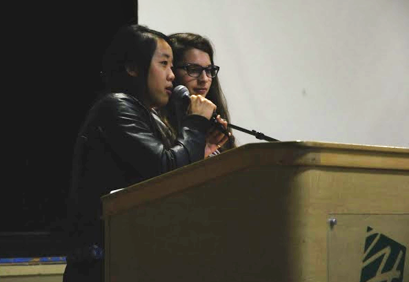 Spirit Co-Presidents Julia Wang (11) and Katy Sanchez (11) make an announcement in school meeting about the results from homecoming week. Homecoming week was September 23 - 27.