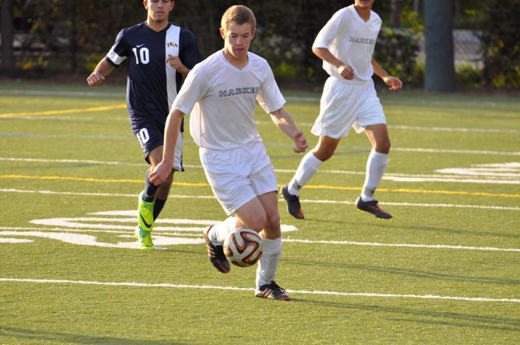 Senior Kevin Moss dribbles past a Kings Academy player. The Eagles went on to win 4-1.