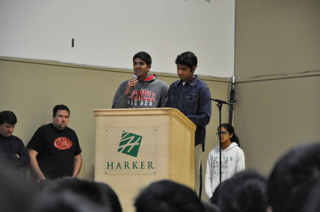 Co-founders Vamsi Gadiraju (11) and Vedant Thyagaraj (11) announce their new Harker Economics Club at school meeting. The club plans to promote a greater interest in economics within the school community. 