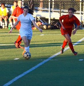 Lyndsey Mitchell (9) dribbles the ball down the field during the January 13 game against Castilleja. The girls are now league champions for the first time in school history.