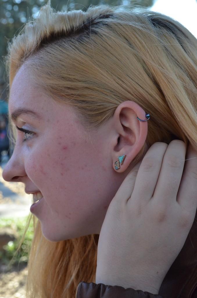 Zoe Woehrmann (11) sports a cartilage piercing on her left earlobe and double piercings on her right and left earlobes.