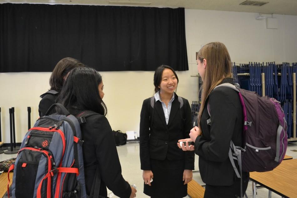 Upper School debaters discuss their arguments after five rounds of alternating stances on the issue of having single gender classrooms for public schools. The state-qualifying tournament for public forum was held yesterday and today at Leland High School.  