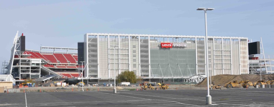 While other parts remain in the middle of construction, Levis Stadiums exterior has mostly been completed. The bright red sign and seats match the 49ers colors. 